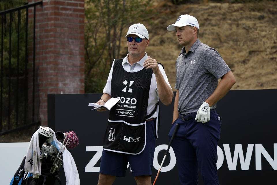 Shawn Spieth, left, caddies for his son Jordan Spieth during the first round of the Zozo Championship golf tournament Thursday, Oct. 22, 2020, in Thousand Oaks, Calif. (AP Photo/Marcio Jose Sanchez)