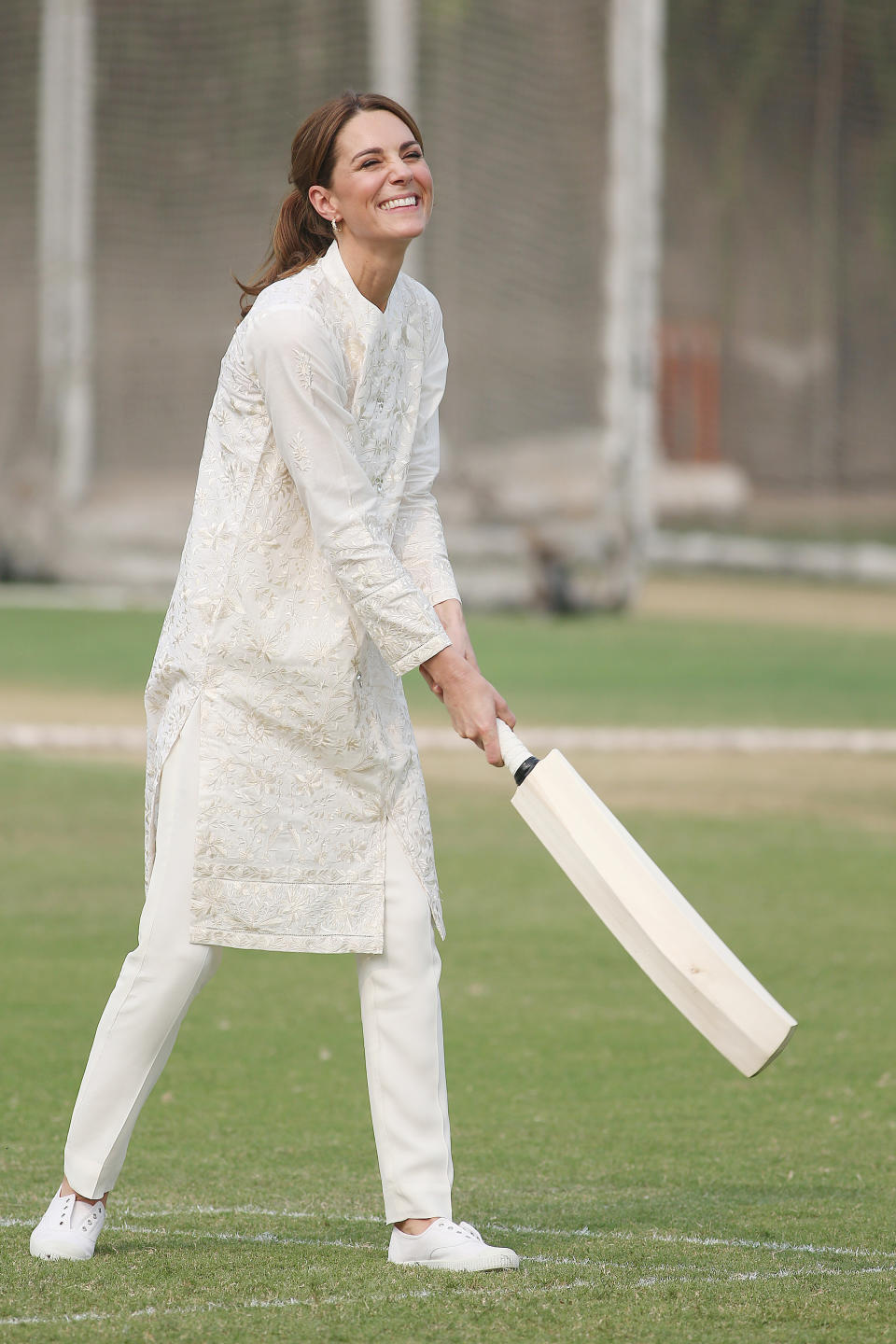 Kate wore a chic all-white outfit on day four, which was made up of a traditional embroidered shalwar kameez, which had been custom made by Pakistani brand, Gul Ahmed. The 37-year-old finished off the look with<a href="https://fave.co/2Jd7cXd" rel="noopener" target="_blank" data-ylk="slk:affordable £28 trainers;elm:context_link;itc:0;sec:content-canvas" class="link "> <strong>affordable £28 trainers</strong></a> by British brand, Hampton Canvas. [<em>Photo: Getty]</em>