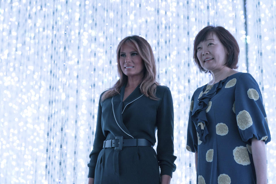 U.S. first lady Melania Trump, left, stands with Japanese Prime Minister Shinzo Abe's wife Akie Abe during a visit to a digital art museum in Tokyo Sunday, May 26, 2019. (Pierre-Emmanuel Deletree/Pool Photo via AP)