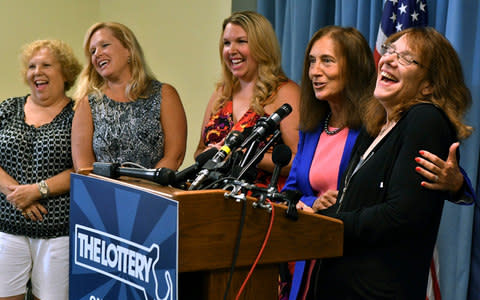 Ms Wanczyk was flanked by state treasurer Deb Goldberg and her mother and two sisters  - Credit: AP