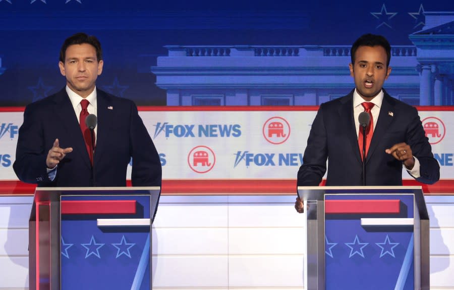 Republican presidential candidates (L-R), Florida Gov. Ron DeSantis and Vivek Ramaswamy participate in the first debate of the GOP primary season hosted by FOX News at the Fiserv Forum on August 23, 2023 in Milwaukee, Wisconsin. (Photo by Win McNamee/Getty Images)