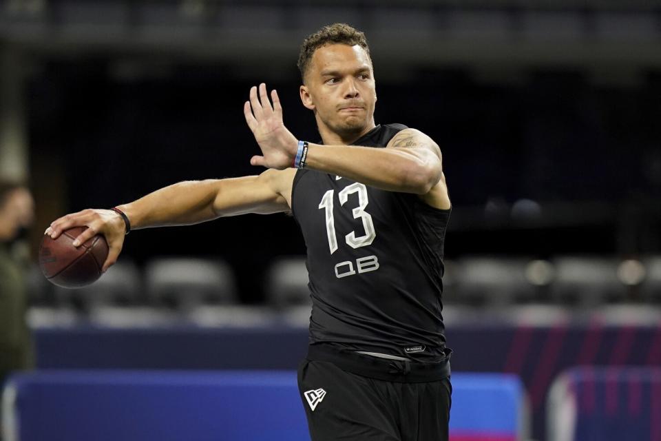 Cincinnati quarterback Desmond Ridder warms up at the scouting combine Thursday.