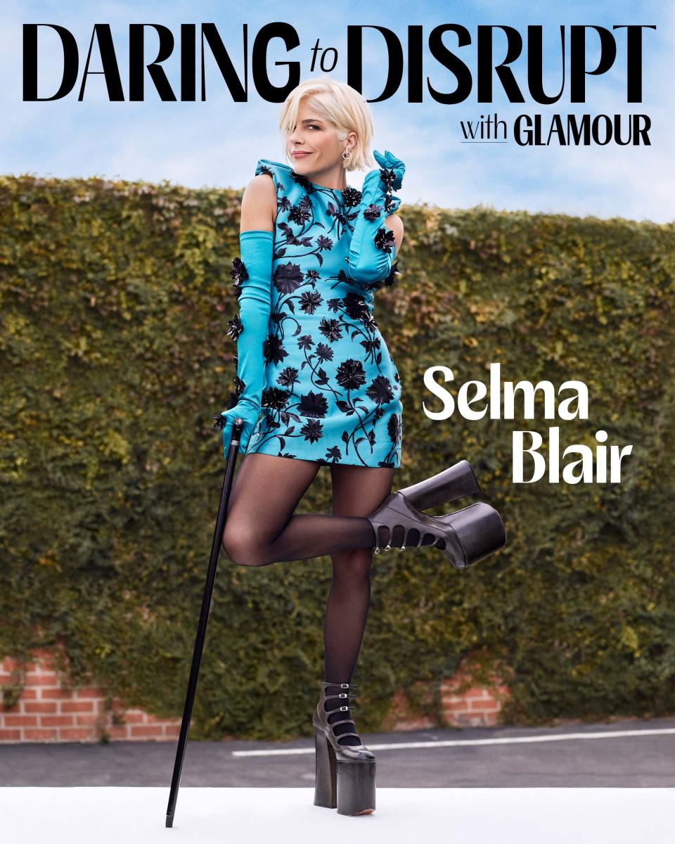 <cite class="credit">Versace dress and gloves. Ana Khouri earrings. Calzedonia tights. Marc Jacobs boots.</cite>