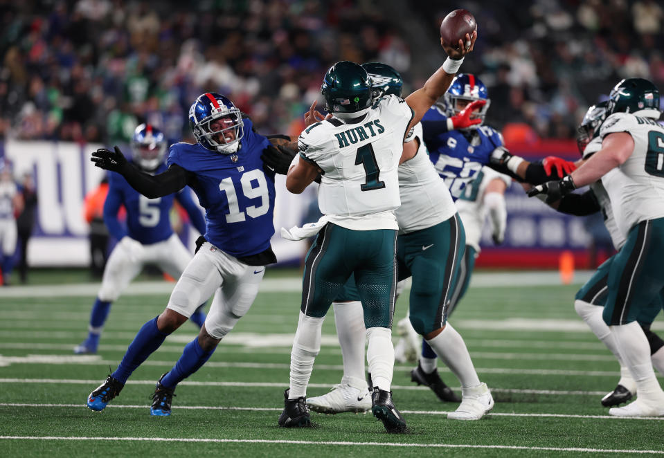 EAST RUTHERFORD, NEW JERSEY – JANUARY 07: Jalen Hurts #1 of the Philadelphia Eagles passes against Isaiah Simmons #19 of the New York Giants during their game at MetLife Stadium on January 07, 2024 in East Rutherford, New Jersey. (Photo by Al Bello/Getty Images)