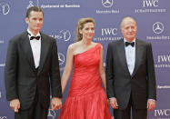 FILE - In this May 22, 2006 file photo, Spain's King Juan Carlos, right, arrives with his daughter, Princess Cristina and her husband Inaki Urdangarin for the Laureus World Sports Awards in Barcelona, Spain. As the British royal family wrestles with the future roles of Prince Harry and his wife Meghan, it could look to Europe for examples of how princes and princesses have tried to carve out careers away from the pomp and ceremony of their families’ traditional duties. Members of Spain’s royal family hold down many honorary jobs but only Princess Cristina and her now-imprisoned husband were known to be active in the private sector. (AP Photo/Jasper Juinen, File)