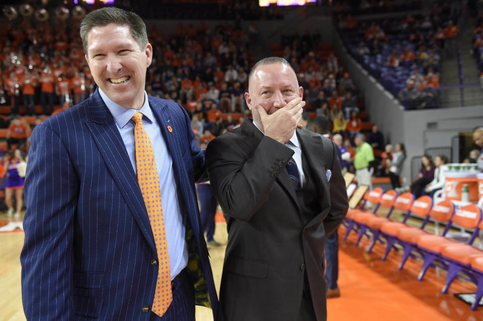 Clemson's head coach Brad Brownell, left, shares a laugh with Virginia Tech head coach Buzz Williams before the first half of an NCAA college basketball game Saturday, Feb. 9, 2019, in Clemson, S.C.. (AP Photo/Richard Shiro)