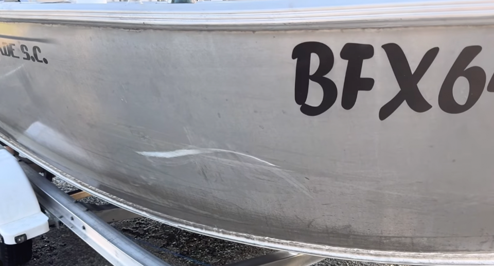 Large teeth marks the huge shark left on the dinghy. 