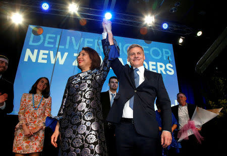 FILE PHOTO - New Zealand Prime Minister Bill English and his wife Mary react on stage alongside family members during an election night event in Auckland, New Zealand, September 23, 2017. REUTERS/Nigel Marple/File photo