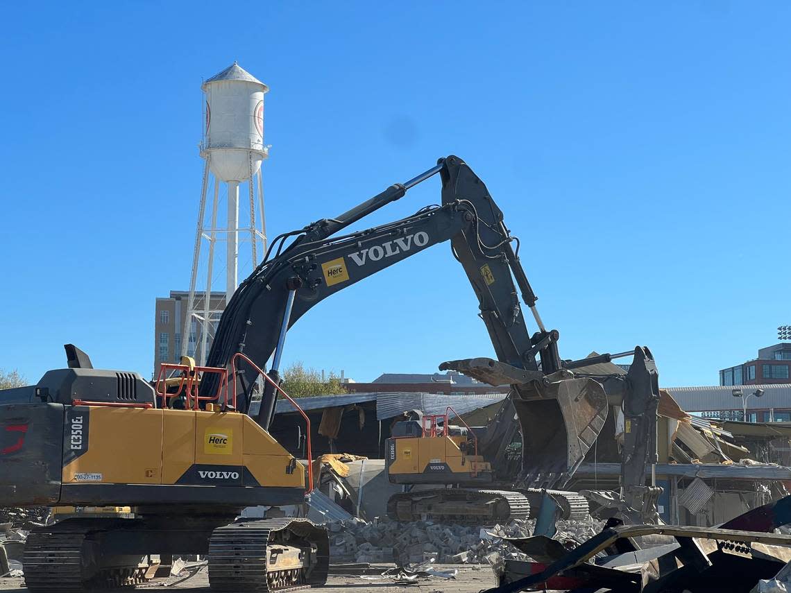 Crews began razing the former University Ford property at 601 Willard Street, paving way for the planned expansion of the American Tobacco Campus.