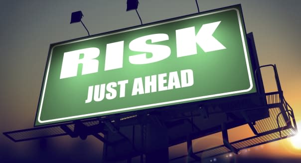 Risk Just Ahead on Green Billboard.