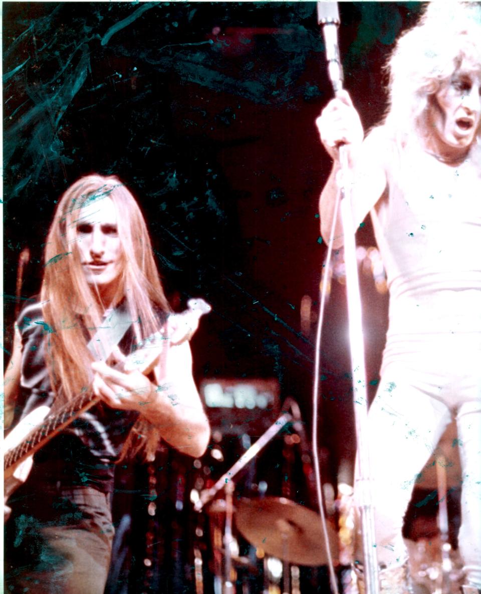 Rick Anderson on stage in the '70s with Fee Waybill