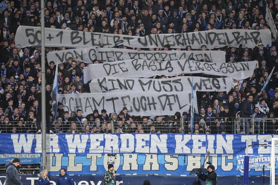 Bochum supporters protest against investors during the German Bundesliga soccer match between VfL Bochum and Union Berlin in Bochum, Germany, on Dec. 16, 2023. From Brazil to Spain to Australia and beyond, the soccer landscape is changing quickly with a surge of investment firms injecting billions into clubs and leagues around the world. After a wave of wealthy states, billionaires and oligarchs getting into the sport, now it’s time for investment groups to start making a push to leave their footprints and earn a profit. (AP Photo/Martin Meissner, File)