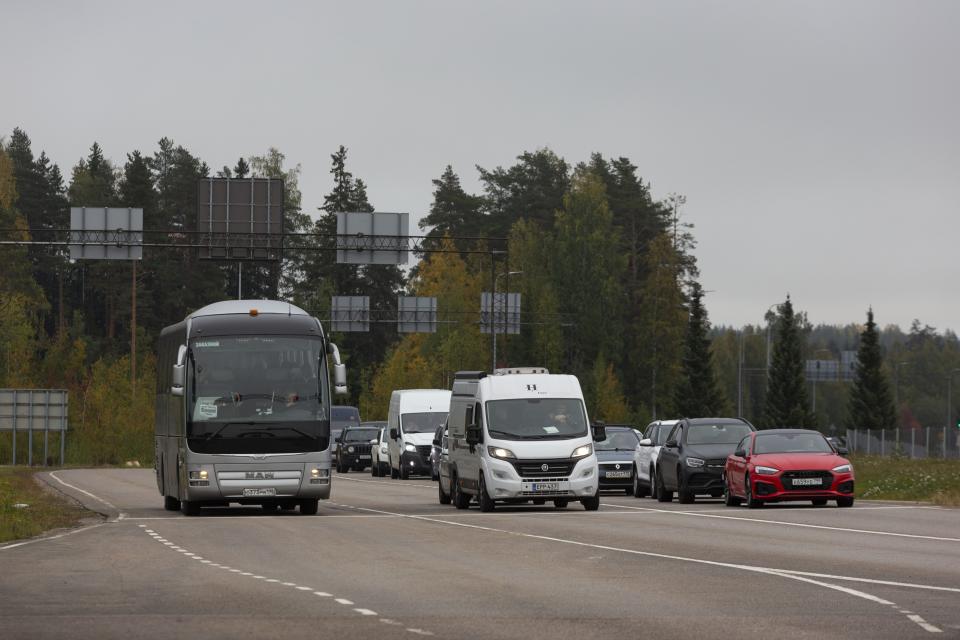 Cars coming from Russia wait in lines at the Vaalimaa border check point between Finland and Russia in Virolahti, Eastern Finland Wednesday, Sept. 28, 2022. The mass exodus of men — alone or with their families or friends — began Sept. 21, shortly after Putin’s address to the nation, and continued all this week. Early on, they snapped up airline tickets, which spiked in price on the few airlines still flying out of Russia. But the rest had to gas up their cars and join the long lines snaking on roads toward the borders. (Sasu M'kinen/Lehtikuva via AP)