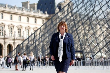 Scotland's external affairs minister Fiona Hyslop poses in front of the Louvre Pyramid designed by Chinese-born U.S. Architect Ieoh Ming Pei in Paris, France, September 26, 2016. REUTERS/Charles Platiau