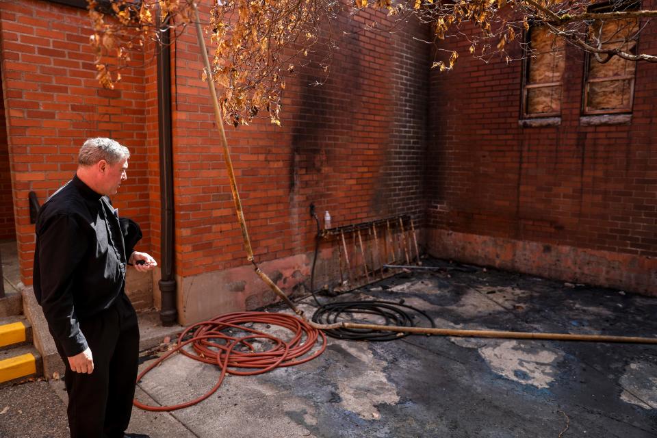 Father Jeff Meeuwsen looks at the area where the fire was set that damaged St. Joseph Catholic Church on Wednesday, Sept. 20, 2023 in Salem, Ore.