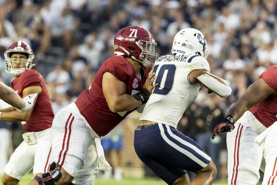 Alabama offensive lineman Darrian Dalcourt blocks Utah State linebacker AJ Vongphachanh during the first half of an NCAA college football game, Saturday, Sept. 3, 2022, in Tuscaloosa, Ala. Vongphachanh transferred to BYU for his senior season. | Vasha Hunt, Associated Press