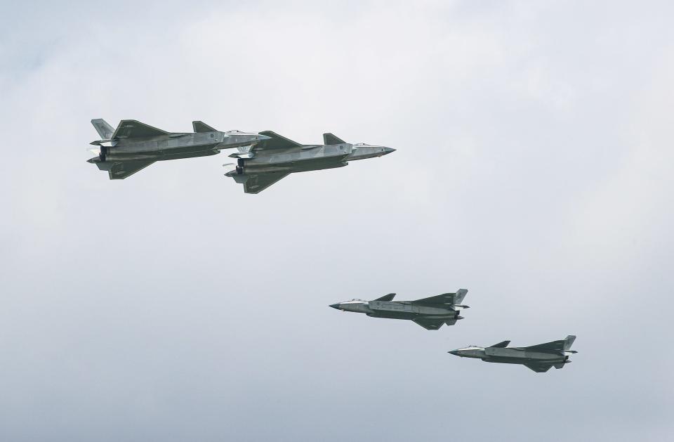 J-20 stealth fighter jets perform during the 2023 Changchun Air Show