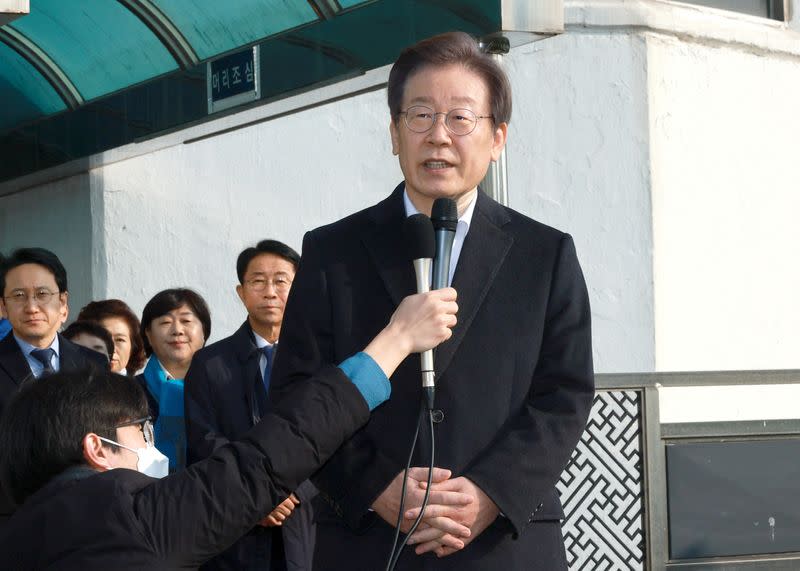 South Korean opposition leader Lee Jae-myung speaks after being discharged from the hospital in Seoul