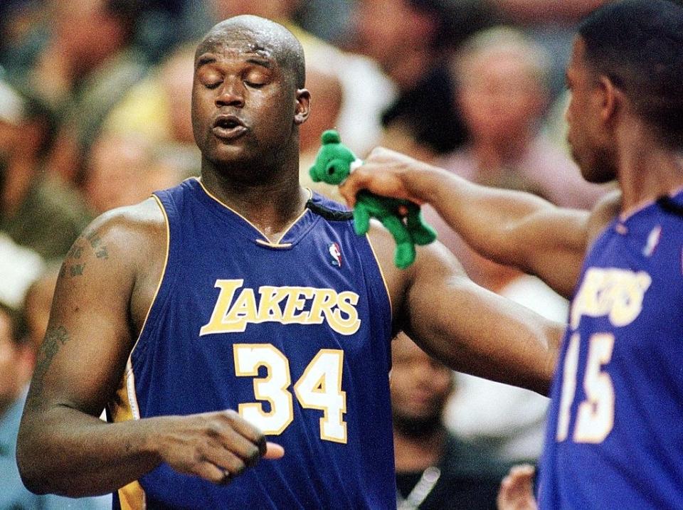 Shaq is given a green beanie baby