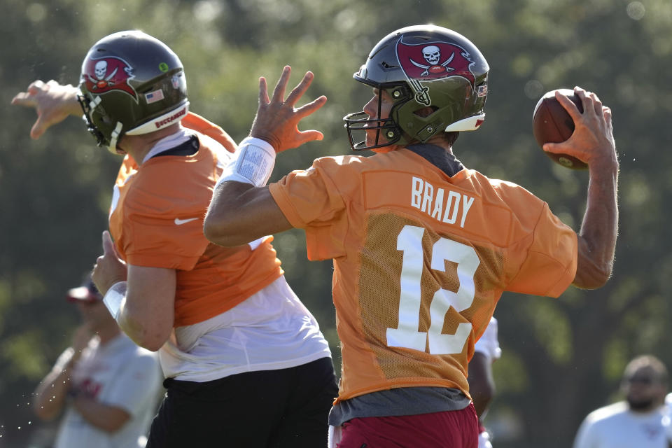 Tampa Bay Buccaneers quarterback Tom Brady (12) throws a pass during an NFL football training camp practice Wednesday, July 27, 2022, in Tampa, Fla. (AP Photo/Chris O'Meara)