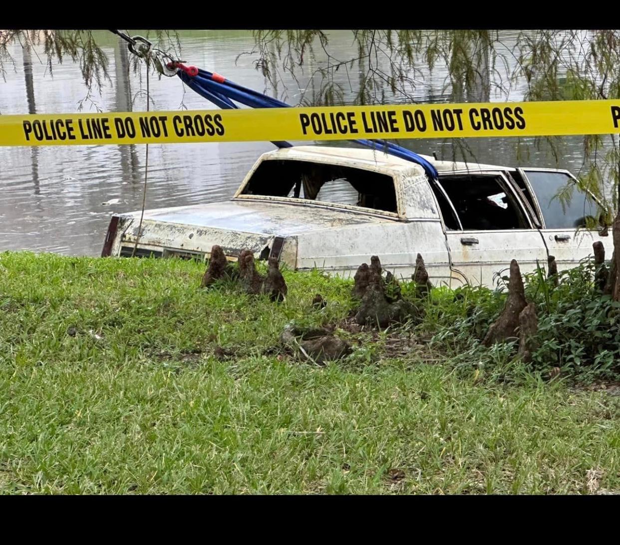 An Oldsmobile containing human remains pulled from a mall pond in Florida. Sunrise police said the car was last registered in 2005.