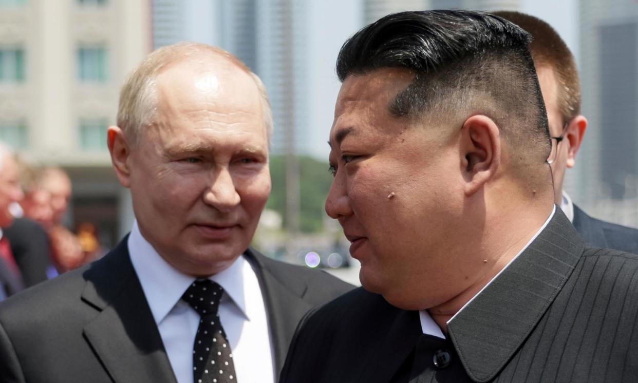 <span>Vladimir Putin, left, and North Korea's leader Kim Jong-un attend the official welcome ceremony for the Russian president in the Kim Il Sung Square in Pyongyang, North Korea, on 19 June.</span><span>Photograph: Gavriil Grigorov/AP</span>