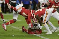 San Francisco 49ers' Tarvarius Moore, on the turf, clutches the ball after his interception against the Kansas City Chiefs during the second half of the NFL Super Bowl 54 football game Sunday, Feb. 2, 2020, in Miami Gardens, Fla. (AP Photo/Matt York)