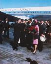 <p>President John F. Kennedy and First Lady Jackie Kennedy move down a reception line shortly after their arrival in Dallas. Hours after this photograph was taken, the President was assassinated. </p>