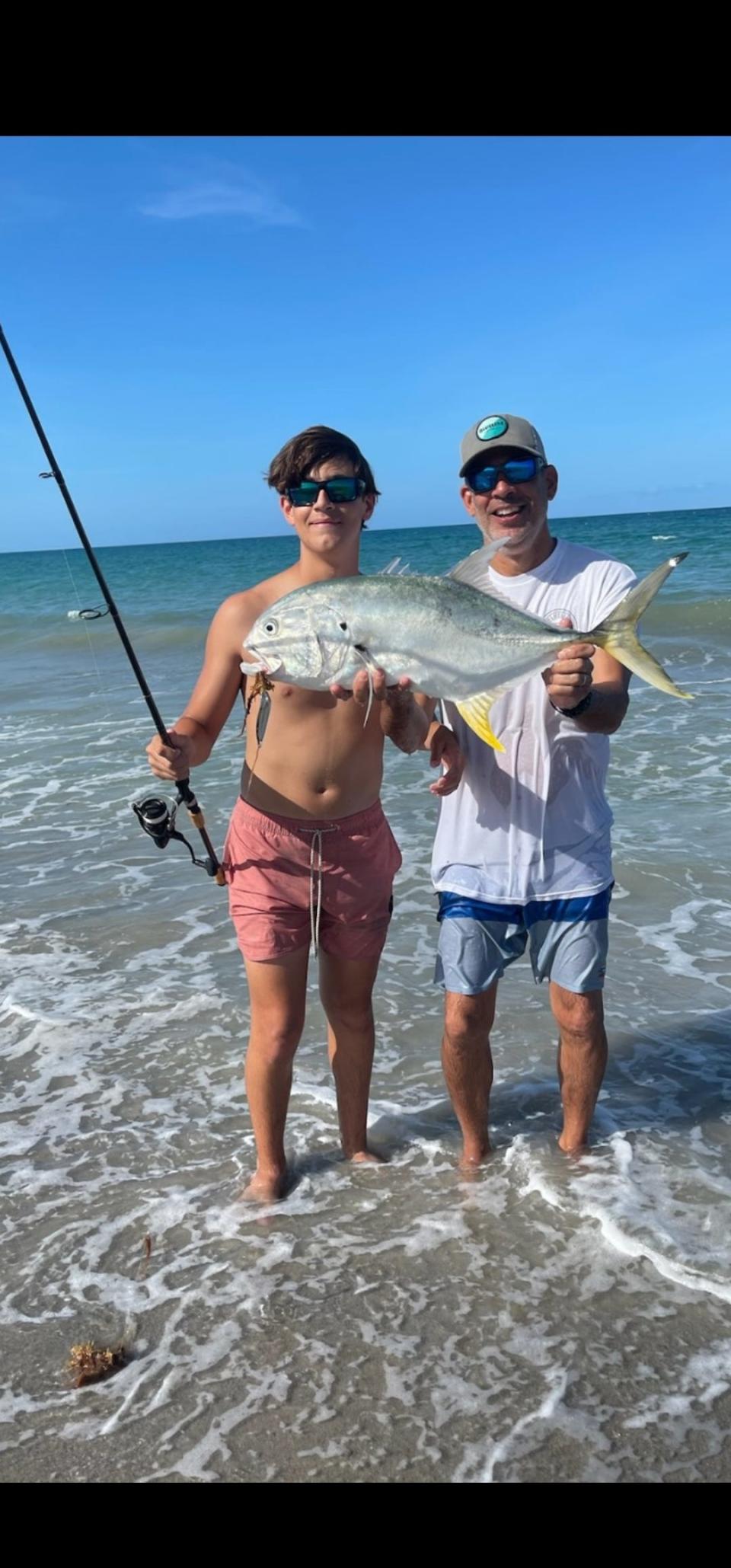 Fishing at Juno Beach, Lucas (left) and his dad Arnoldo Puig used a spoon to catch and release this impressive jack crevalle.