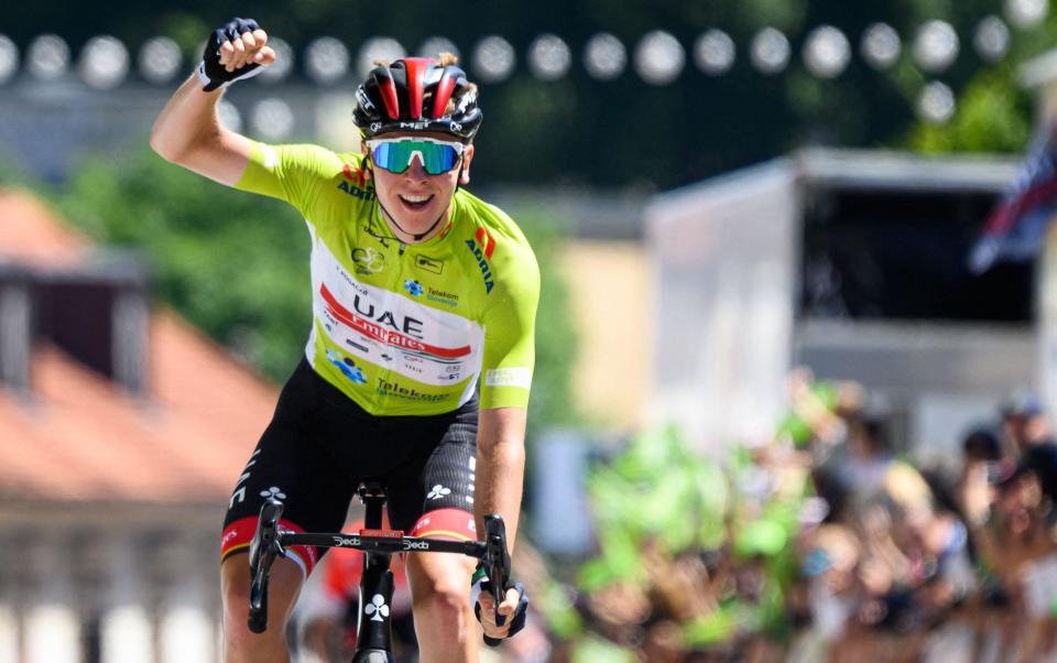 Slovenias cyclist Tadej Pogacar reacts as he crosses the finish line to win the 5th and last stage (155,7 km from Vrhnika to Novo mesto) during the Tour of Slovenia cycling race in Ljubljana on June 19, 2022 - AFP