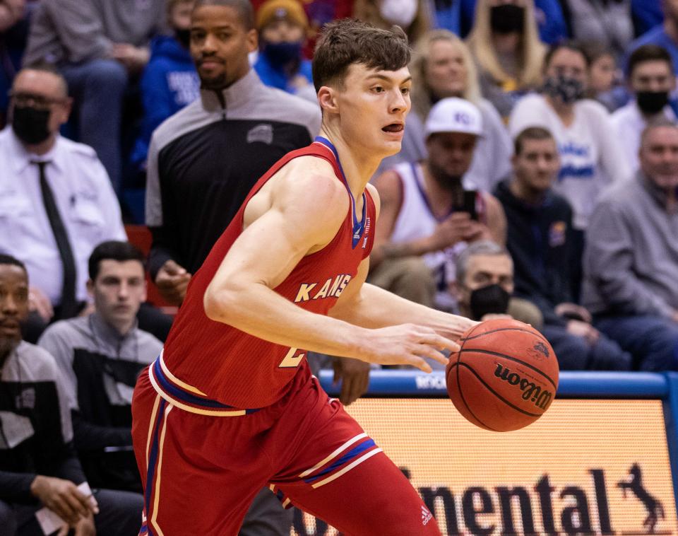 Kansas junior guard Christian Braun dribbles the ball against George Mason. Kansas won 76-67 on Saturday at Allen Fieldhouse.