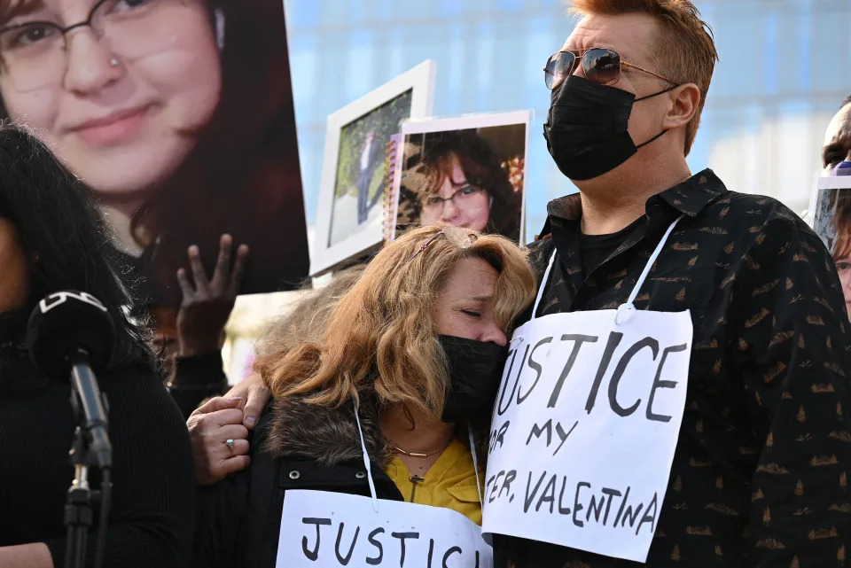 Soledad Peralta and Juan Pablo Orellana Larenas (R), parents of 14-year old Valentina Orellana-Peralta, who was killed by a stray police bullet last week while shopping at a clothing store, attend at a press conference outside Los Angeles Police Department headquarters in Los Angeles, California, December 28, 2021. (Photo by Robyn Beck / AFP) (Photo by ROBYN BECK/AFP via Getty Images)