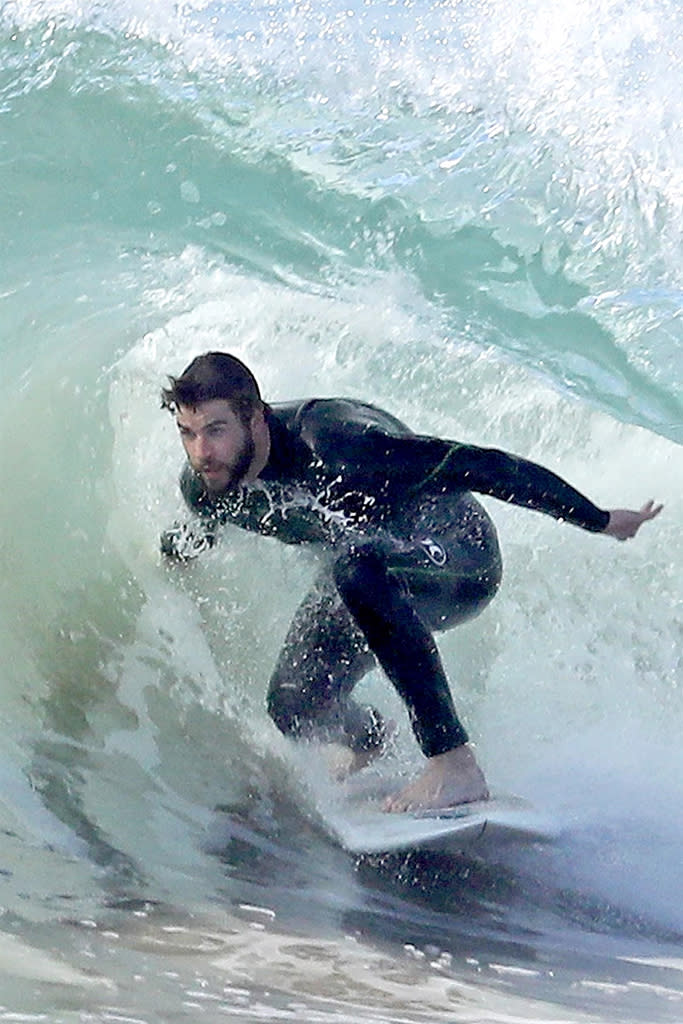 <p>The surfing fan hit the waves Sunday morning with a few pals in Malibu, Calif. Miley’s man has major ocean skills, and looked like a total pro. (Photo: BACKGRID) </p>