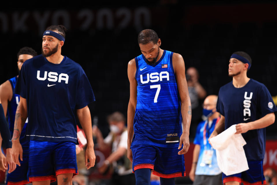 <p>SAITAMA, JAPAN - JULY 25: Kevin Durant #7 and JaVale McGee #11 of Team United States walk off the court after the United States lost to France in the Men's Preliminary Round Group B game on day two of the Tokyo 2020 Olympic Games at Saitama Super Arena on July 25, 2021 in Saitama, Japan. (Photo by Mike Ehrmann/Getty Images)</p> 