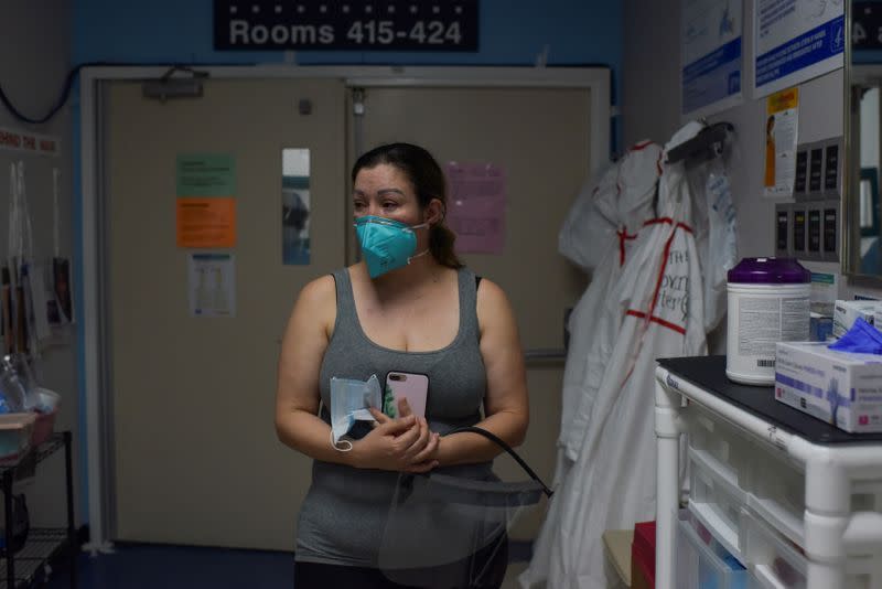 A woman says goodbye to her mother in a COVID-19 ICU in Houston