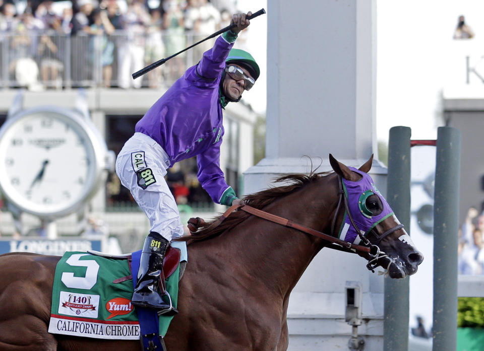 FILE - In this May 3, 2014, file photo, jockey Victor Espinoza celebrates aboard California Chrome after winning the 140th running of the Kentucky Derby horse race at Churchill Downs in Louisville, Ky. The California colt will be running in the Preakness with a bulls-eye on his back as perhaps racing's next superstar. He figures to face eight or nine rivals in the middle leg of the Triple Crown series, and one of them might be a filly. (AP Photo/Morry Gash, File)