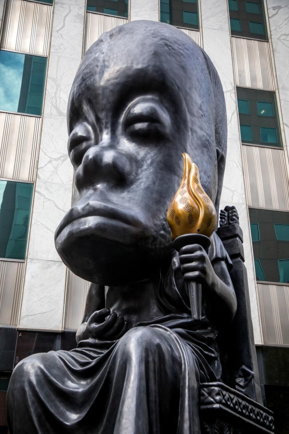 "Oracle," a sculpture by Sanford Biggers, sits in the new terrace outside the main building.