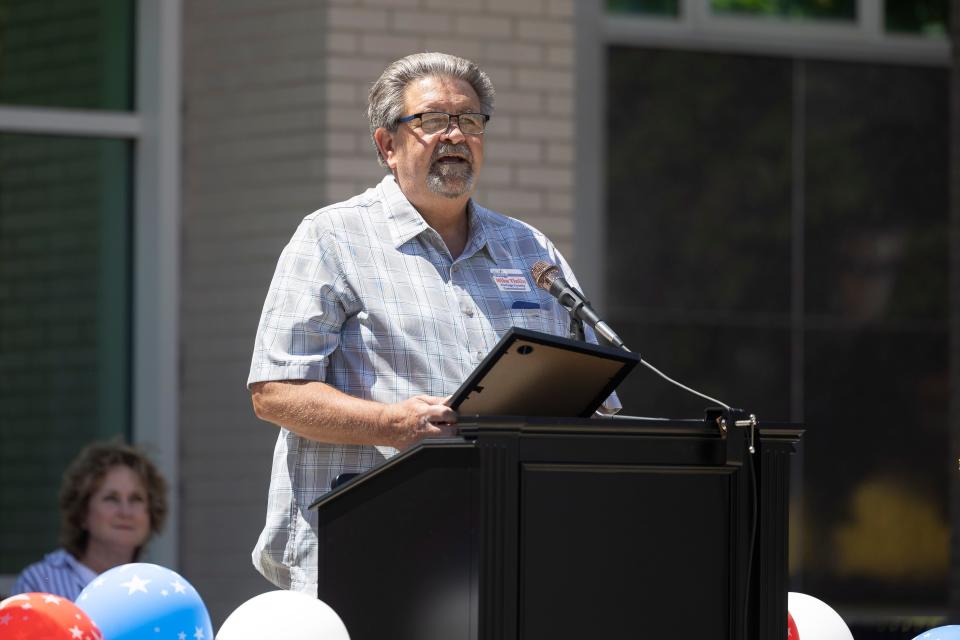 Portage County Commissioner Mike Tinlin reads from a proclamation from Ohio Gov. Mike DeWine at the City of Ravenna’s 225th birthday celebration in downtown Ravenna on Saturday, June 8, 2024.