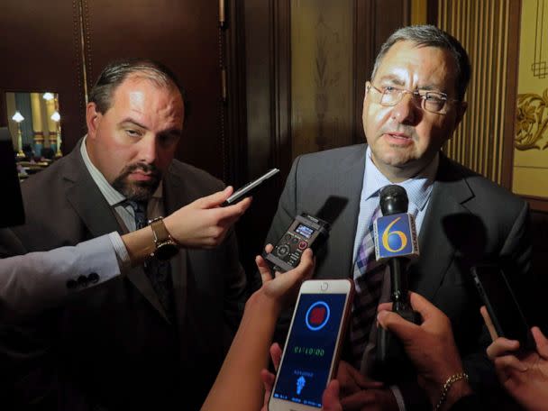 PHOTO: Sen. Jim Stamas, right, and Senate Minority Leader Jim Ananich speak to reporters about the release of their panel's report and recommendations related to the Flint water crisis outside the Michigan Senate chamber, Oct. 19, 2016, in Lansing, Mich.  (David Eggert/AP)