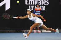 Emma Raducanu of Britain plays a forehand return to Sloane Stephens of the U.S. during their first round match at the Australian Open tennis championships in Melbourne, Australia, Tuesday, Jan. 18, 2022. (AP Photo/Tertius Pickard)