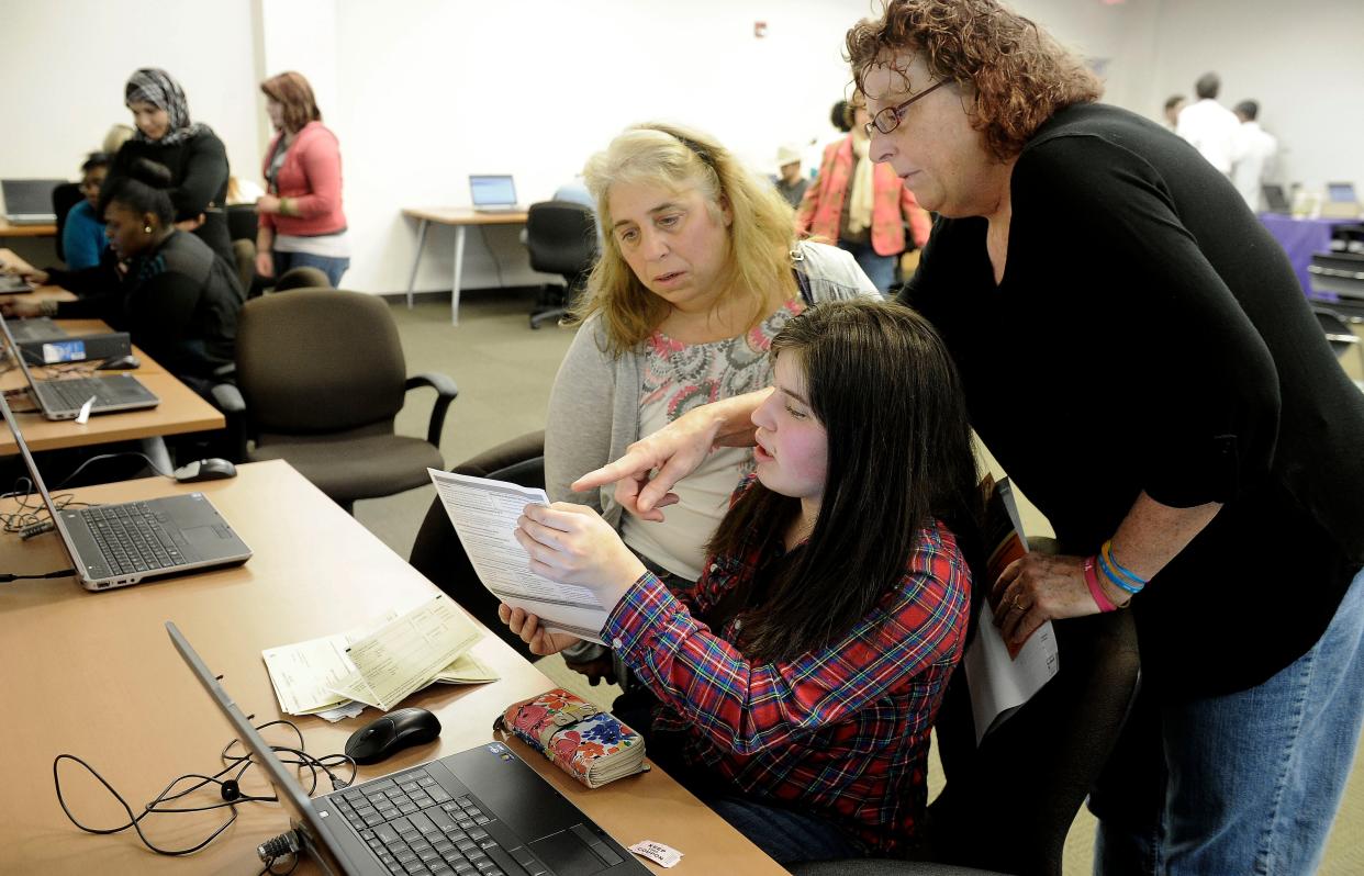 Assistant Director of Finance Vicki Preston, helps out Megan Sadler, 17, and mother Elizabeth Sadler with financial assistance. Nashville State Community College hosts students and their parents who need to fill out the FAFSA before the upcoming Tennessee Promise deadline on Saturday Feb. 7, 2015, in Nashville in Tenn.