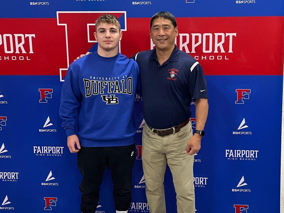 Fairport wrestling coach Bob Arao, right, with Brady Unger, who won a state championship in 2023.