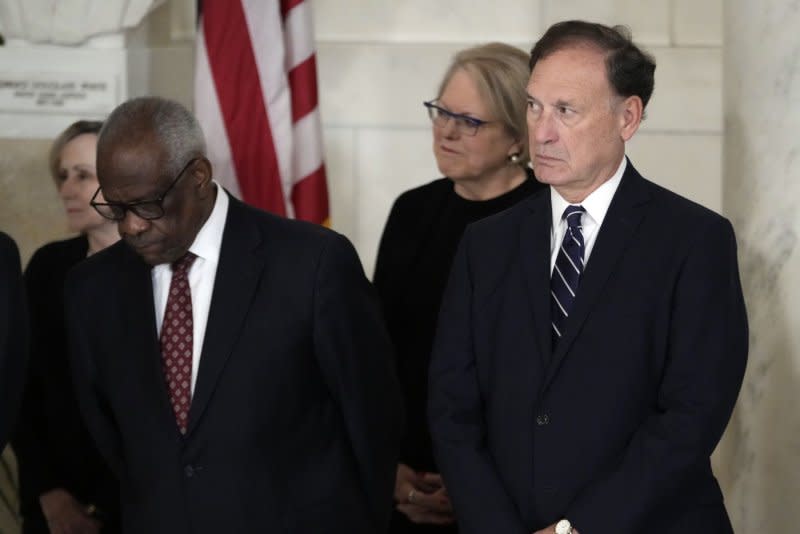 "This case asks whether a bump stock -- an accessory for a semiautomatic rifle that allows the shooter to rapidly reengage the trigger (and therefore achieve a high rate of fire) -- converts the rife into a 'machine gun,’” Justice Clarence Thomas (L) wrote in the court's opinion to strike down a bump stock ban. 

“We hold that it does not and therefore affirm,” said Thomas in his opinion voting along with Justice Samuel Alito (R). Pool photo by Jacquelyn Martin/UPI