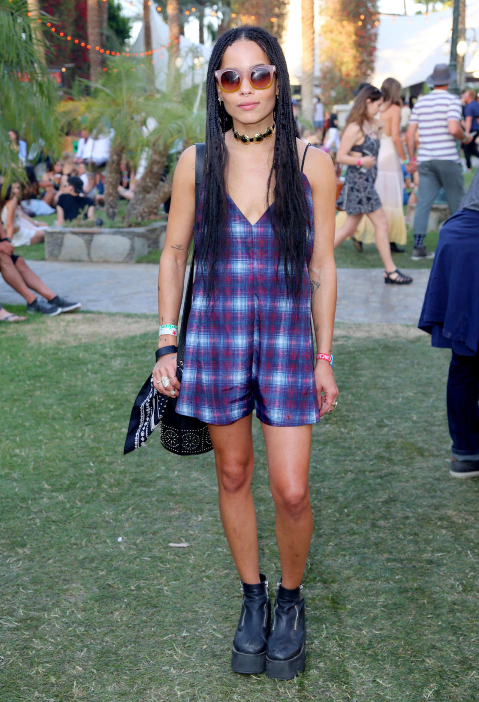 Before hitting the stage with her band Lolawolf, Zoe Kravitz was spotted wearing a plaid romper, Marc by Marc Jacobs sunglasses, platfrom creeper boots, and carrying a tribal-patterned bucket bag.