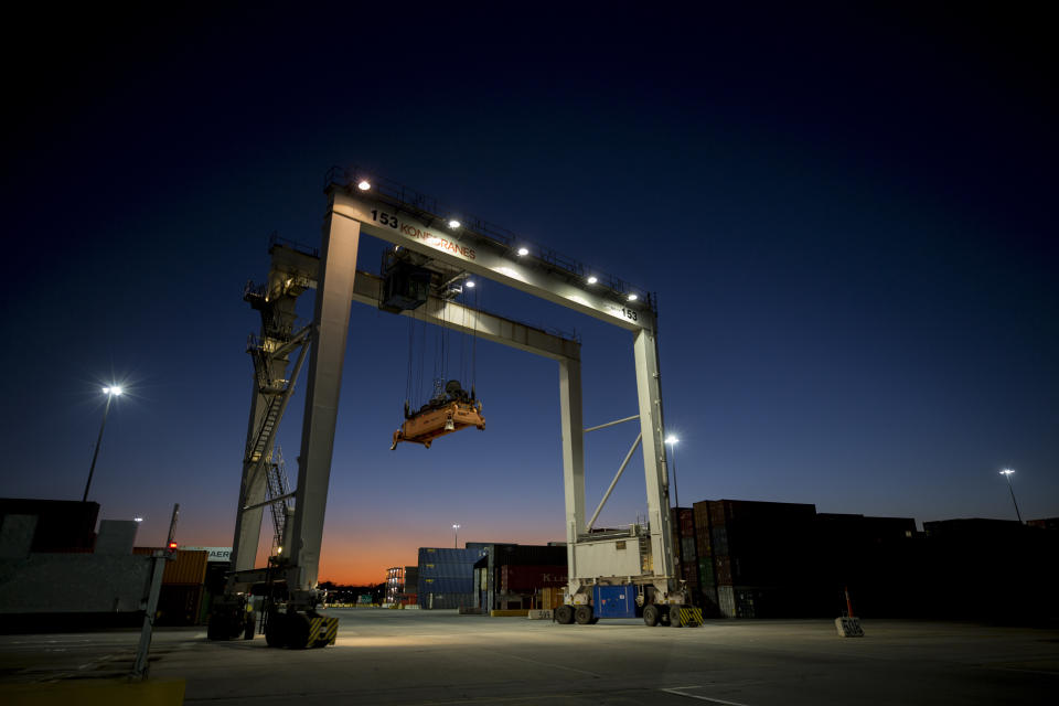 FILE- In this Jan. 30, 2018, file photo a rubber tire gantry moves into position to transfer shipping containers at the Georgia Ports Authority's Port of Savannah in Savannah, Ga. The path to peace in a trade war between the United States and China is getting harder to find as the world's two biggest economies pile ever more taxes on each other's products. (AP Photo/Stephen B. Morton, File)