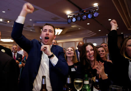 Supporters of Senator Joe Manchin (D-WV) celebrate after he won the 2018 midterm election in Charlestown, West Virginia, U.S., November 6, 2018. REUTERS/Joshua Roberts