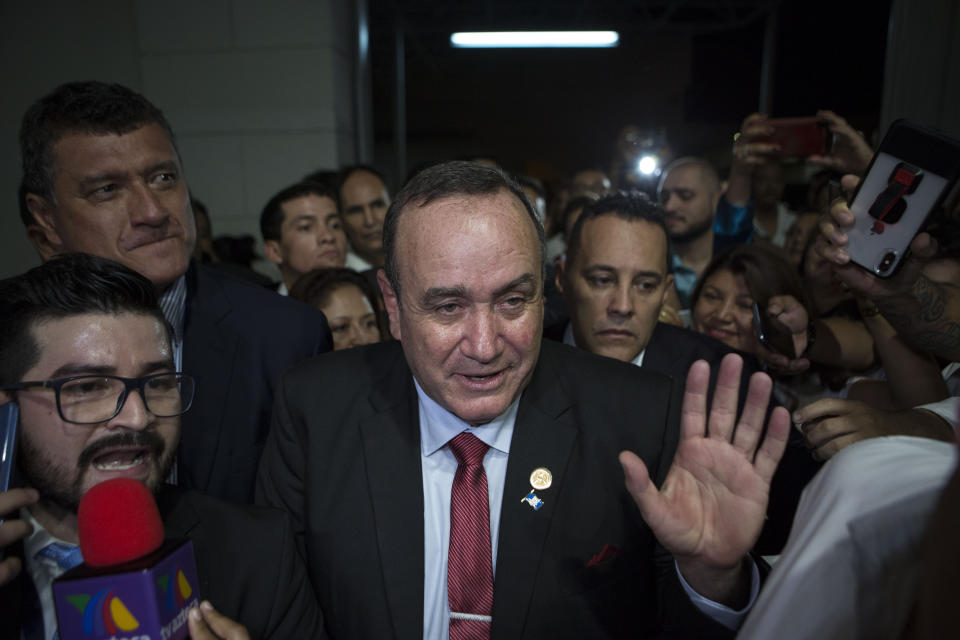 Alejandro Giammatei, presidential candidate of the Vamos party, arrives to the Electoral Supreme Court headquarters for interviews with the press after partial election results were announced in Guatemala City, Sunday, Aug. 11, 2019. Giammattei headed for a victory in Sunday’s presidential runoff election, garnering favor with voters for his get-tough approach on crime and socially conservative values. (AP Photo/Oliver de Ros)