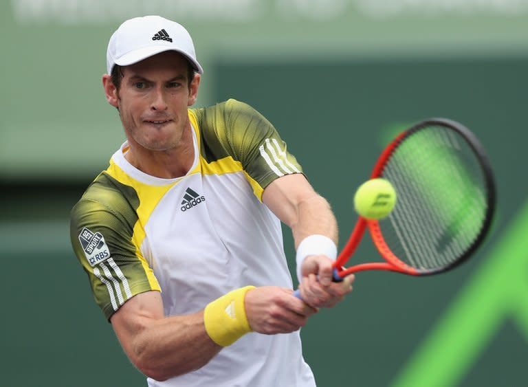 Andy Murray plays a backhand return to Grigor Dimitrov on March 25, 2013. Murray blasted nine aces en route to a 7-6 (7/3), 6-3 victory over the Bulgarian in the third round of the Miami Masters