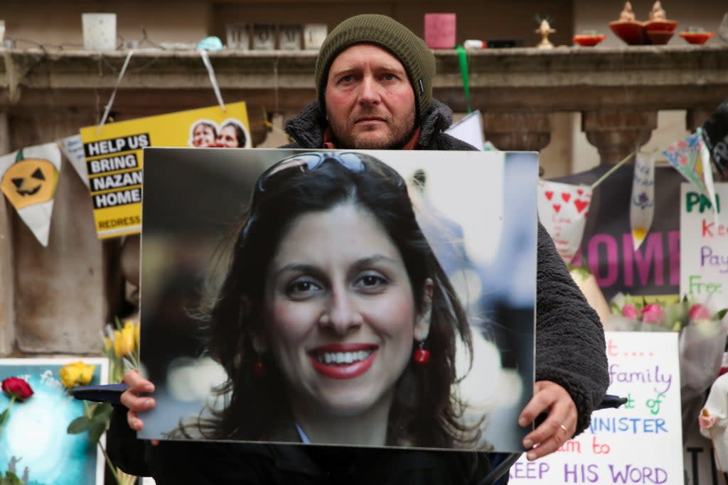 Richard Ratcliffe clutches wife’s picture on 19th day of hunger strike outside  Foreign Office in November  (Reuters)