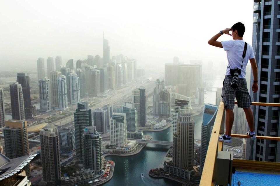 Russian student Marat Dupri scales huge skyscrapes with his friends to capture vertigo-inducing pictures (Caters)